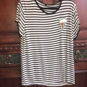 Long striped shirt with a lightning bolt patch